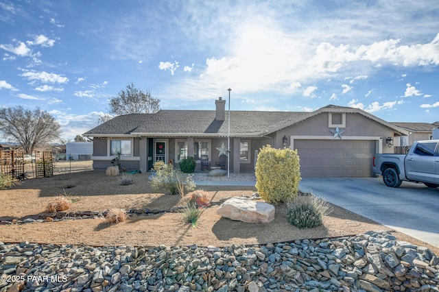 ranch-style home featuring a chimney, stucco siding, fence, a garage, and driveway