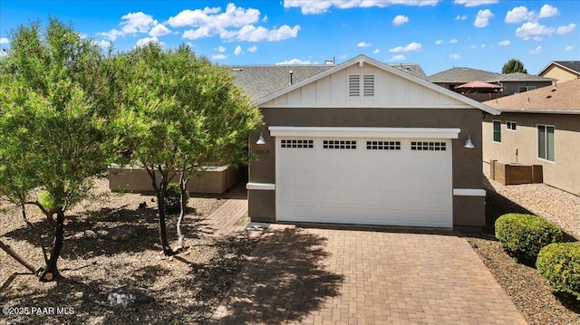 13058 E Acosta St, Dewey-Humboldt, AZ 86327 - view of front of house with a garage, board and batten siding, and driveway