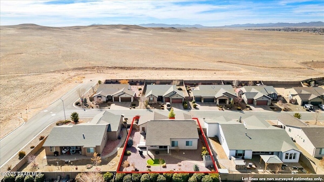 birds eye view of property featuring a mountain view