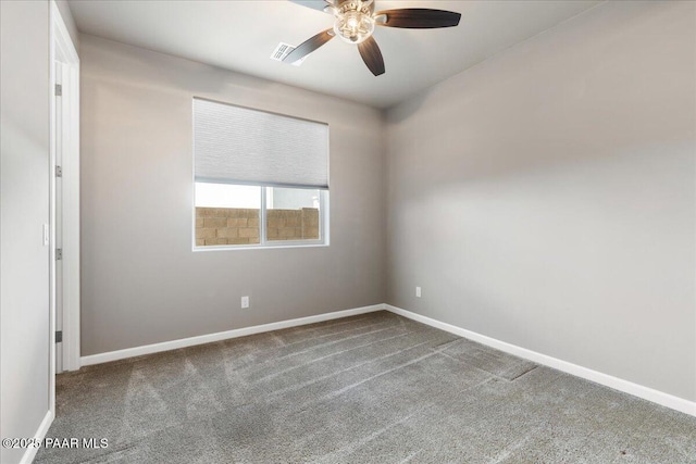 empty room with ceiling fan and carpet flooring