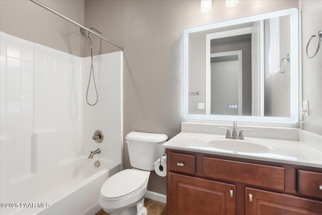 full bathroom featuring vanity, washtub / shower combination, and toilet