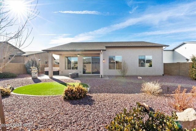 back of house featuring a patio and ceiling fan