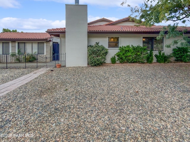 410 Apache Plume Trl, Prescott, AZ 86301 - view of front of home featuring a tiled roof, stucco siding, and a chimney