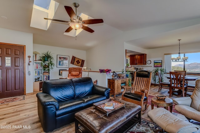 930 Ohio St, Prescott, AZ 86303 - living area with a ceiling fan, light wood-style floors, vaulted ceiling, and a chandelier
