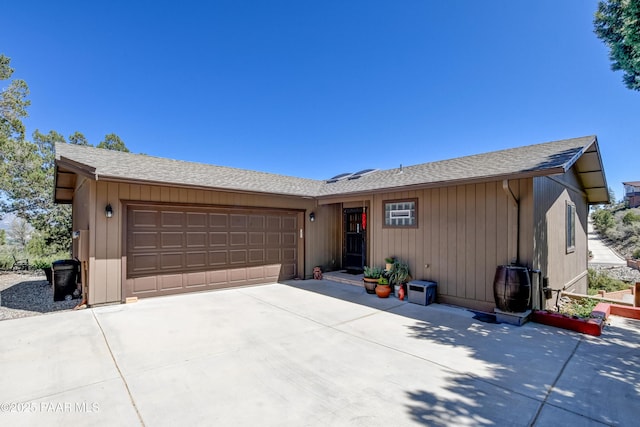 930 Ohio St, Prescott, AZ 86303 - ranch-style home featuring a garage, concrete driveway, and roof with shingles