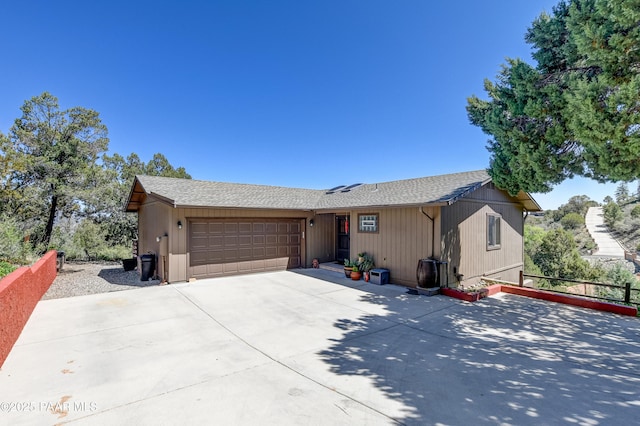 930 Ohio St, Prescott, AZ 86303 - view of front facade featuring a garage, a shingled roof, and driveway