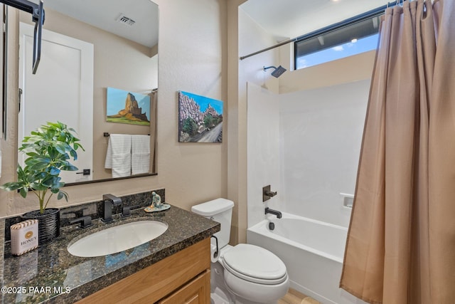 full bathroom with vanity, shower / bathtub combination with curtain, and toilet