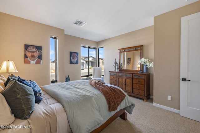 bedroom featuring light carpet and access to outside