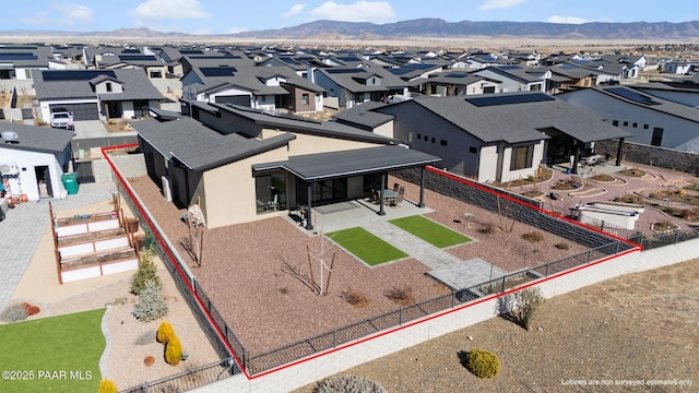 birds eye view of property with a mountain view