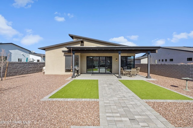 rear view of house featuring a patio