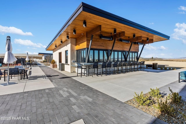 view of property's community featuring a patio area