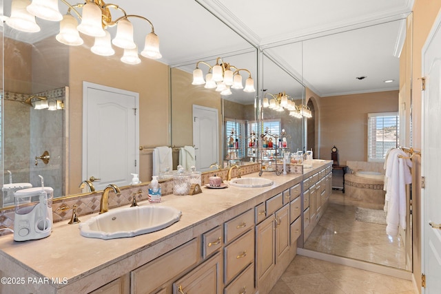 bathroom featuring tile patterned floors, a sink, crown molding, and a chandelier