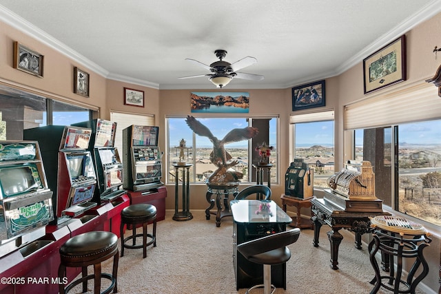 interior space featuring light carpet, a healthy amount of sunlight, ornamental molding, and a ceiling fan