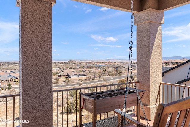 balcony featuring a mountain view and a residential view