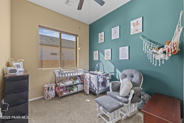 carpeted bedroom featuring a ceiling fan and visible vents