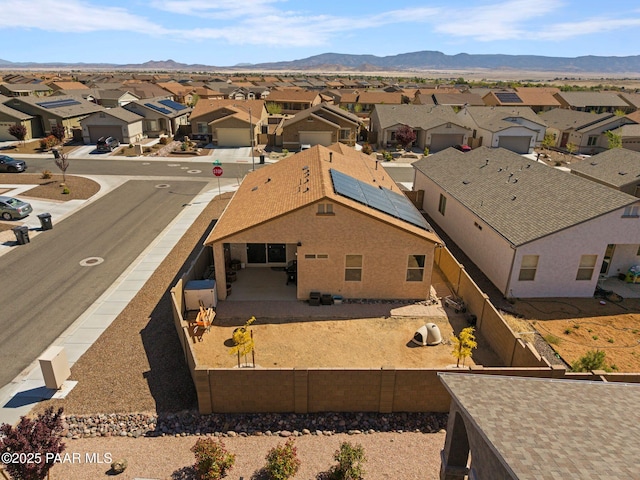 aerial view featuring a mountain view and a residential view