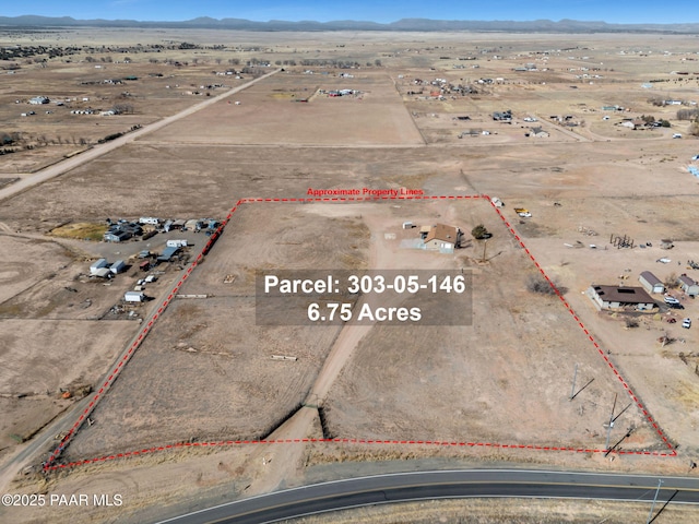 3125 W Big Chino Rd, Paulden, AZ 86334 - aerial view of sparsely populated area with mountains, property boundaries highlighted, and a desert landscape