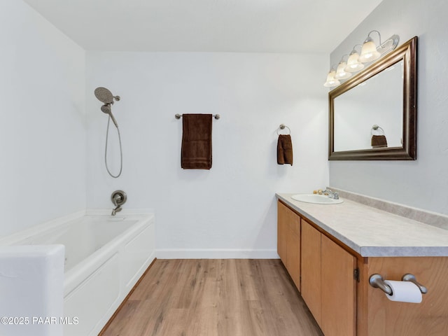 3125 W Big Chino Rd, Paulden, AZ 86334 - full bathroom with wood finished floors, vanity, baseboards, and washtub / shower combination