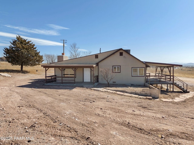 3125 W Big Chino Rd, Paulden, AZ 86334 - rear view of house featuring a chimney and crawl space