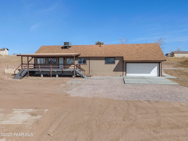 3125 W Big Chino Rd, Paulden, AZ 86334 - view of front of home with an attached garage, driveway, and a shingled roof