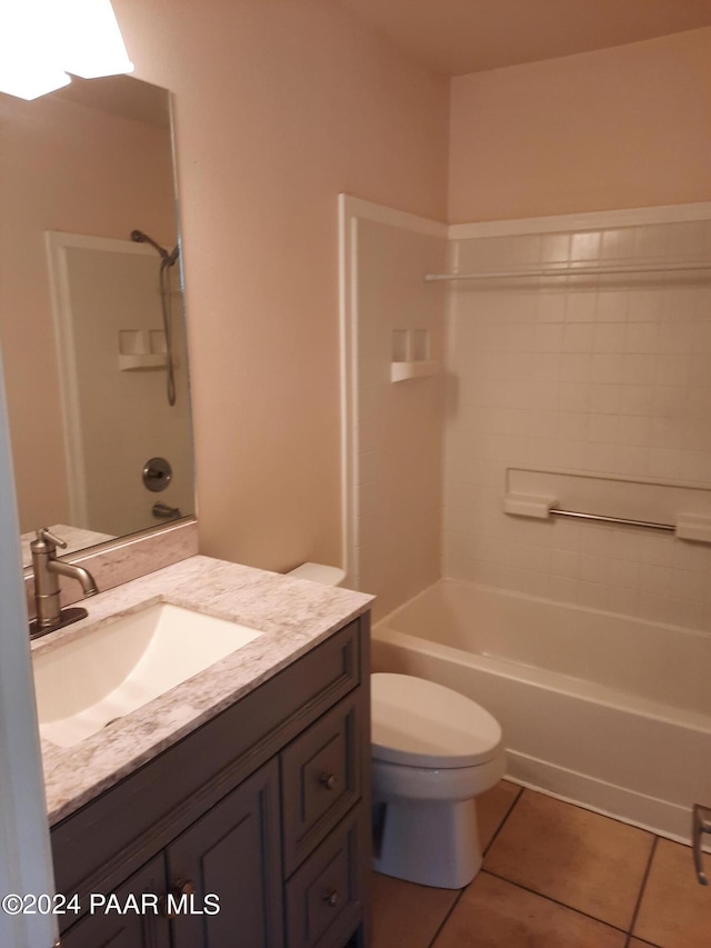 full bathroom featuring tile patterned flooring, vanity, toilet, and washtub / shower combination