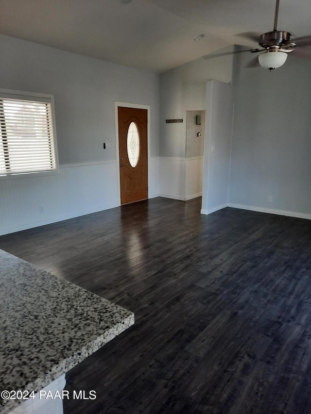 interior space featuring dark hardwood / wood-style floors, a healthy amount of sunlight, and ceiling fan