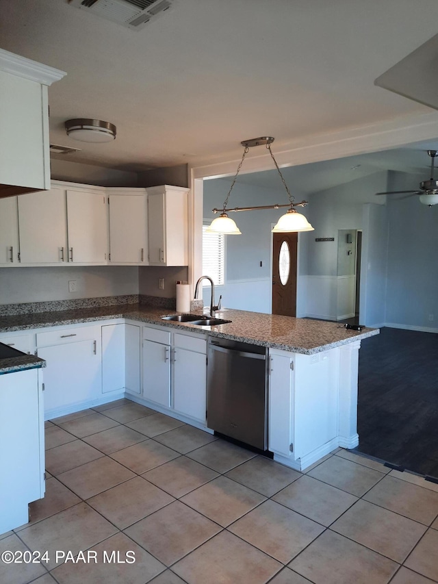 kitchen with stainless steel dishwasher, decorative light fixtures, white cabinetry, and sink