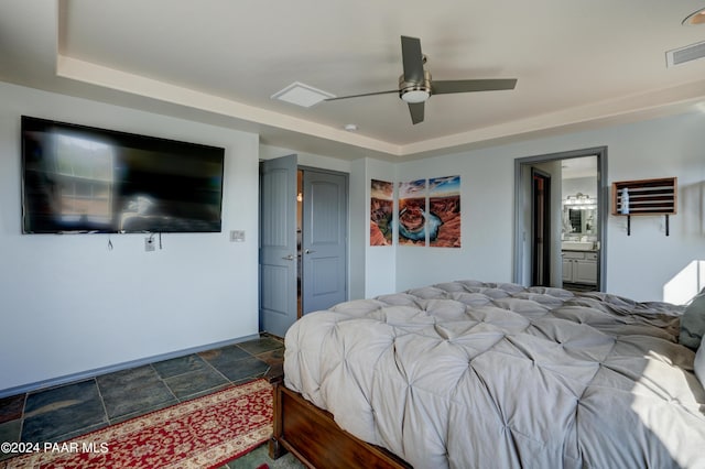 bedroom with ceiling fan and ensuite bath