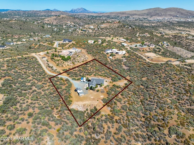 birds eye view of property featuring a mountain view