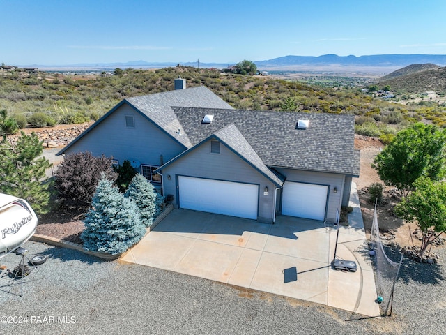 view of front of house featuring a mountain view and a garage