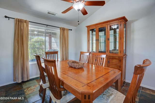 dining area featuring ceiling fan and vaulted ceiling