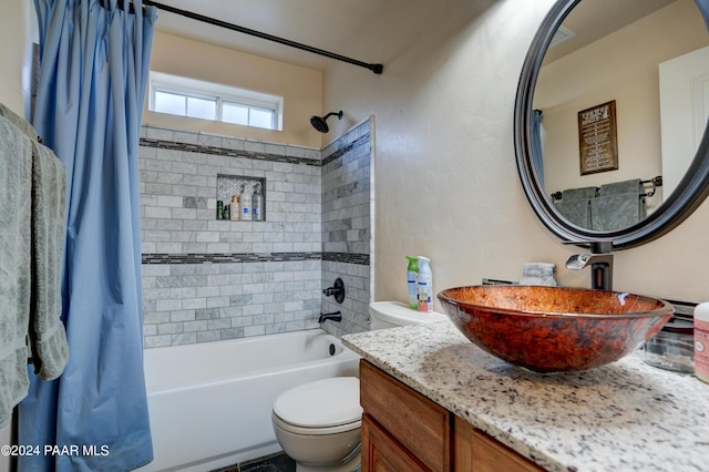 full bathroom with vanity, shower / bath combination with curtain, and toilet