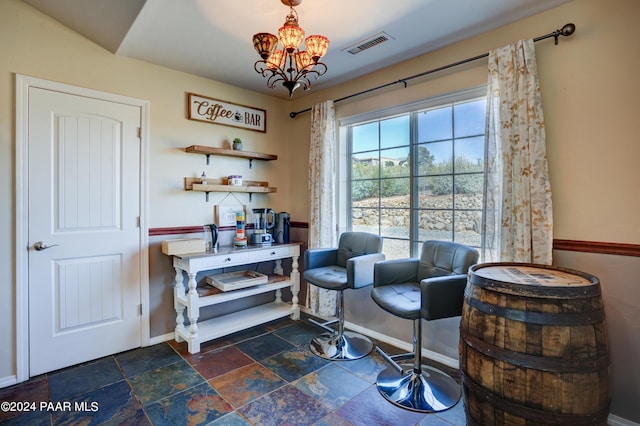 living area featuring an inviting chandelier