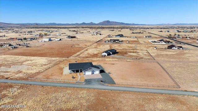 aerial view with view of desert, a rural view, and a mountain view