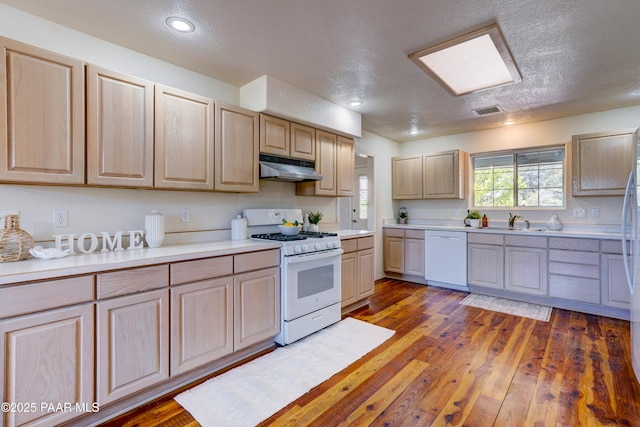 2785 W Bard Ranch Rd, Prescott, AZ 86305 - kitchen featuring white appliances, under cabinet range hood, light brown cabinets, light countertops, and a textured ceiling