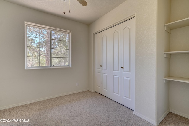 2785 W Bard Ranch Rd, Prescott, AZ 86305 - unfurnished bedroom featuring carpet, a closet, and a ceiling fan
