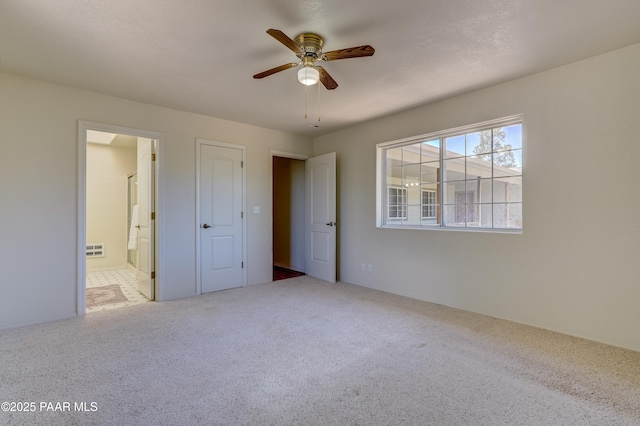2785 W Bard Ranch Rd, Prescott, AZ 86305 - unfurnished bedroom featuring carpet, ensuite bathroom, and ceiling fan