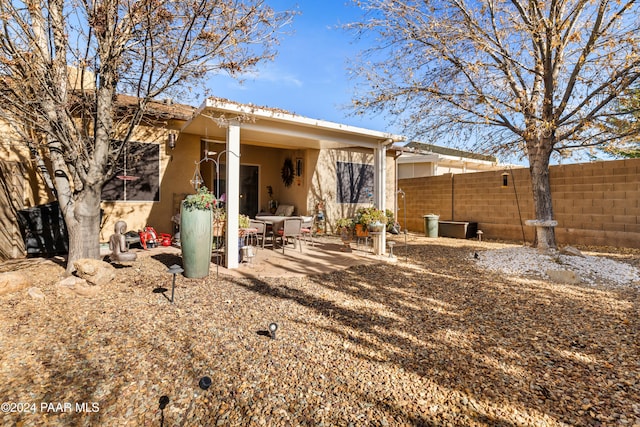 rear view of property featuring a patio