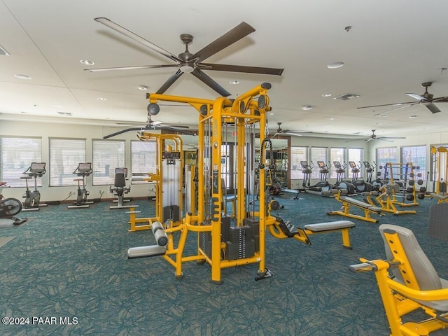 exercise room with ceiling fan