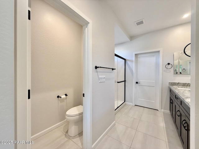 5744 E Killen Loop, Prescott Valley, AZ 86314 - full bathroom featuring tile patterned flooring, toilet, a stall shower, vanity, and baseboards