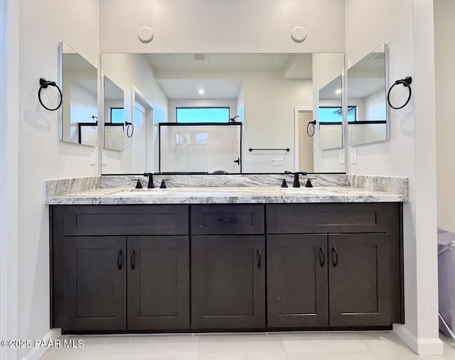5744 E Killen Loop, Prescott Valley, AZ 86314 - full bathroom featuring double vanity and baseboards