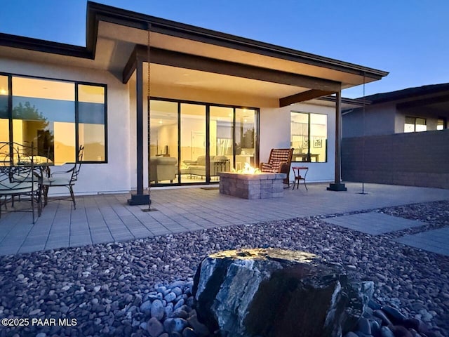 5744 E Killen Loop, Prescott Valley, AZ 86314 - rear view of property featuring a fire pit, a patio area, stucco siding, and fence