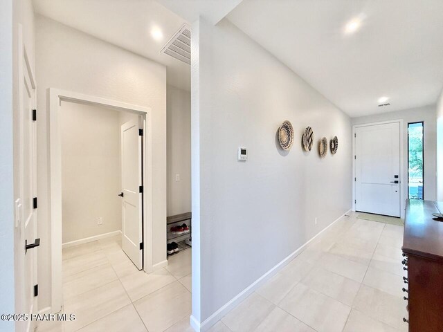5744 E Killen Loop, Prescott Valley, AZ 86314 - hallway featuring light tile patterned floors and baseboards