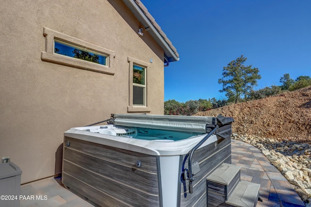 view of patio featuring a hot tub