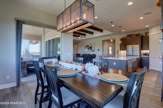 dining area with light hardwood / wood-style flooring