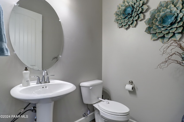 bathroom with toilet and sink