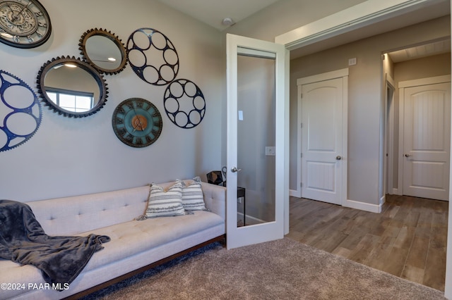 sitting room featuring french doors and hardwood / wood-style flooring