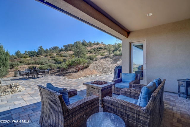 view of patio featuring a fire pit