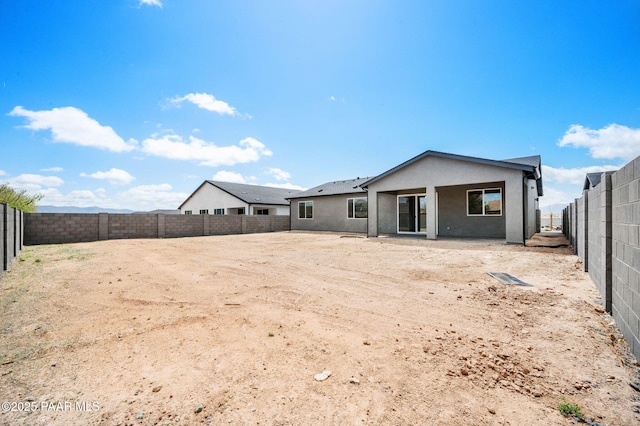 7480 E Louie Ln, Prescott Valley, AZ 86315 - rear view of house with a fenced backyard and stucco siding