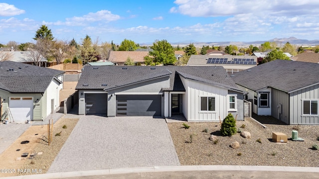 7480 E Louie Ln, Prescott Valley, AZ 86315 - view of front of property featuring decorative driveway, a garage, and board and batten siding